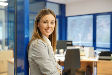 Portrait of businesswoman standing in office