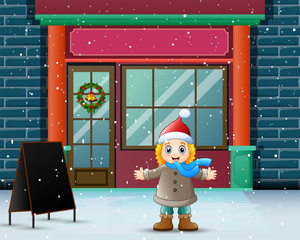 Winter scene with girl standing in front of the store