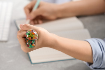 Woman squeezing colorful slime, closeup. Antistress toy