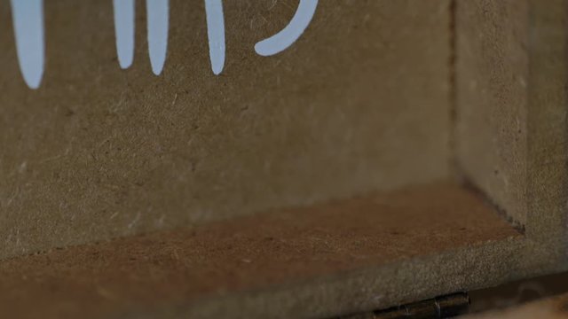 Slider reveal of wedding rings on brown burlap