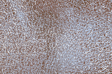 Abstract festive shiny holographic background with a beautiful texture of silver brown chocolate color