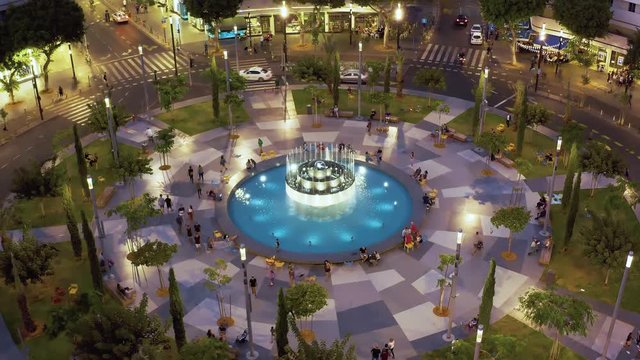Dizengoff square in tel Aviv, Israel, at night, 4k aerial drone view