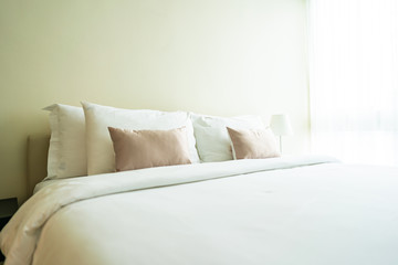 White comfortable pillow on bed decoration interior