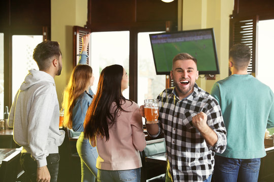 Group of football fans in sport bar