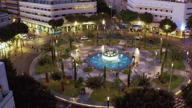 Dizengoff square in tel Aviv, Israel, at night, 4k aerial drone view