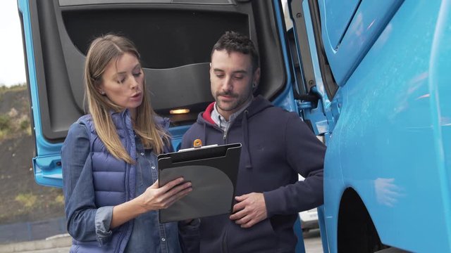 Logistics manager controlling truck driver schedule