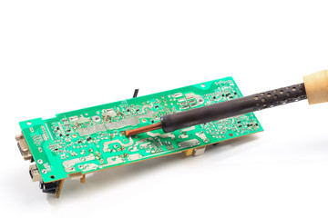 Microcircuit and soldering iron isolated on white background - Image