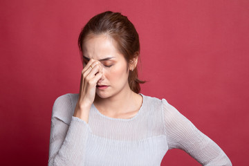 Young Asian woman got sick and  headache.