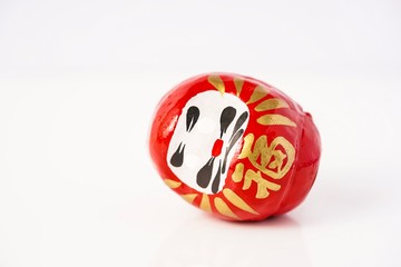Daruma Doll isolated against white