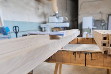 Background carpentry woodworking woodshop, machines and tools, wooden boards