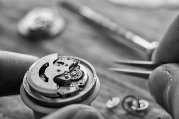 Watchmaker is repairing the wristwatch, mechanical watch
