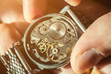 Watchmaker is repairing the wristwatch, mechanical watch