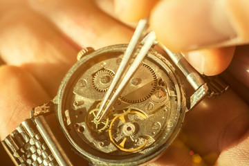 Watchmaker is repairing the wristwatch, mechanical watch