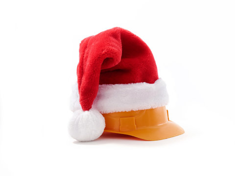 Builder's hard hat in santa hat on white background