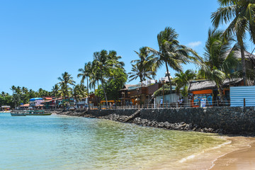 Morro de Sao Paulo, Bahia / Brazil - 11/19/2019: Coastline of Morro de Sao Paulo with colorful houses.
