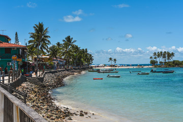 Morro de Sao Paulo, Bahia / Brazil - 11/19/2019: Coastline of Morro de Sao Paulo with colorful houses.
