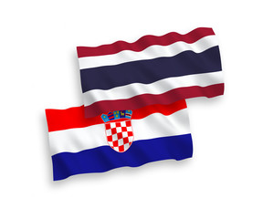 National vector fabric wave flags of Thailand and Croatia isolated on white background. 1 to 2 proportion.