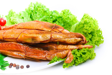 Smoked fish on plate close up