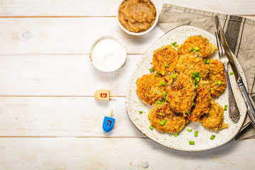 Traditional jewish food potato latkes on wood background, top view