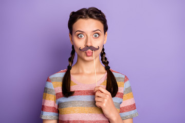 Photo of pretty childish mood lady holding fake paper moustache near mouth acting like guy carnival...