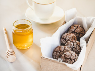 Fresh, fragrant handmade cookies, glass of milk and jar of honey. Close-up, top view. Tasty and healthy eating concept