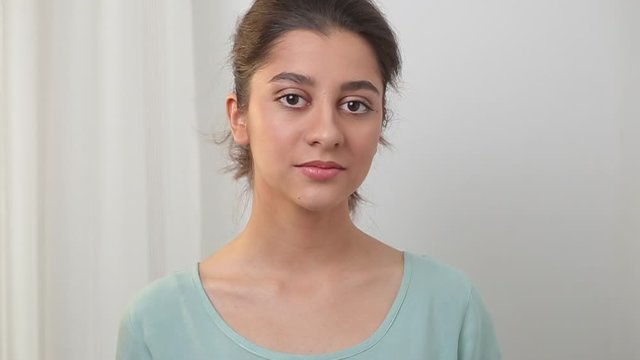 Portrait of a beautiful hispanic girl looking at the camera.