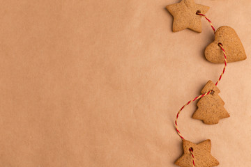 New Year's decor of ginger cookie red ribbon on craft paper