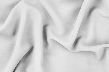 Fototapeta na wymiar Gray jacquard fabric with natural texture. Monochrome texture, background pattern.