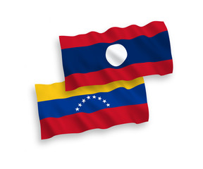 National vector fabric wave flags of Venezuela and Laos isolated on white background. 1 to 2 proportion.
