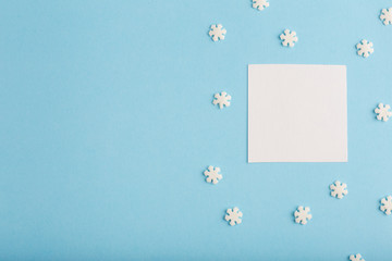 New Year's card with snowflakes on a blue background