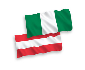 National vector fabric wave flags of Austria and Nigeria isolated on white background. 1 to 2 proportion.