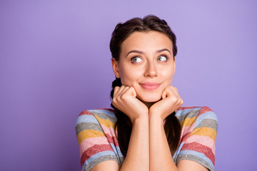 Fototapeta premium Closeup photo of amazing cute lady holding hands under chin looking empty space dreamer imagine flight wear casual striped t-shirt isolated purple color background