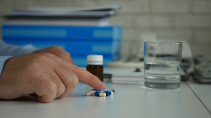 Businessman in Office Suffering a Big Headache Take Medical Pills