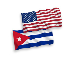 National vector fabric wave flags of Cuba and USA isolated on white background. 1 to 2 proportion.