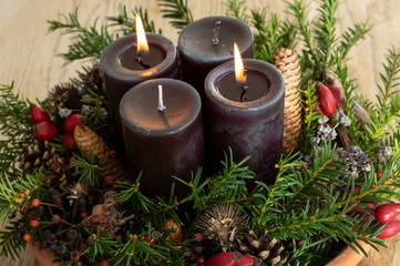christmas decoration with candle and pine cones