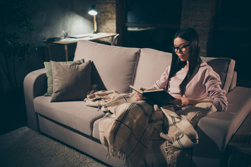 Profile photo of homey lady read exciting historic novel interested book worm sitting couch covered...