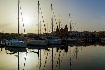 Fototapeta na wymiar Beautiful sunset with boats moored in the harbor, Malta