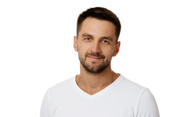 Close-up portrait of smiling handsome bearded man in white shirt looking at camera isolated on white background