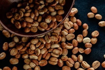 Selecting coffee beans thoroughly, picture on a black background