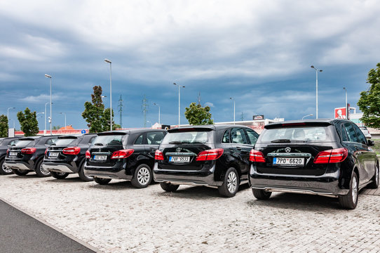 Mercedes Benz cars parked in row
