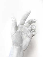 White acrylic paint painted hand with soft shadows