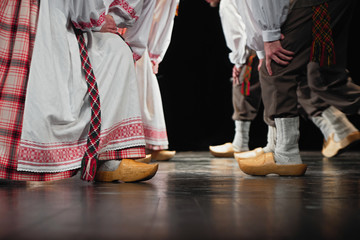 Abstract composition showing legs dressed in Lithuanian traditional clothe dancing in folklore.