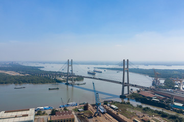 Phu My Bridge on a sunny day with blue sky with shipping on the Saigon River in Ho Chi Minh City, Vietnam