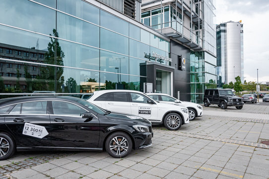 Mercedes Benz cars parked in row