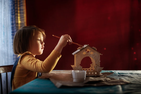 Girl Child Paints Bird Feeder, Cinema Tinting