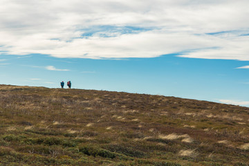 two people backpacking in highland valley scenic view environment life style hiking landscape photography, copy space 