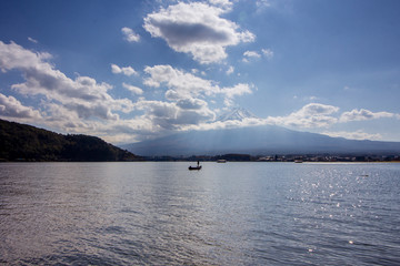 Obraz na płótnie Canvas Fisherman in Kawaguchi lake with Mount Fuji in the background, Japan.