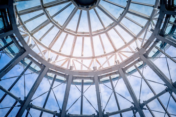 Round Metal ceiling modern architecture with blue sky in the background © junce11