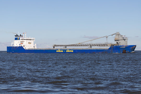 CUXHAVEN, GERMANY - OCTOBER 29, 2019: Mibau Stema self-discharging bulk carrier FITNES on the river Elbe