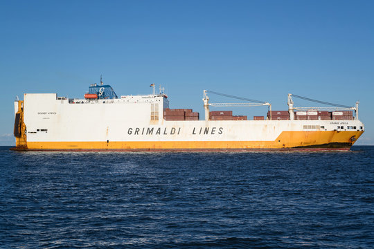 CUXHAVEN, GERMANY - OCTOBER 29, 2019: Grimaldi Lines ConRo ship GRANDE AFRICA on the river Elbe. The Grimaldi Group is a private shipping company based in Naples, Italy.